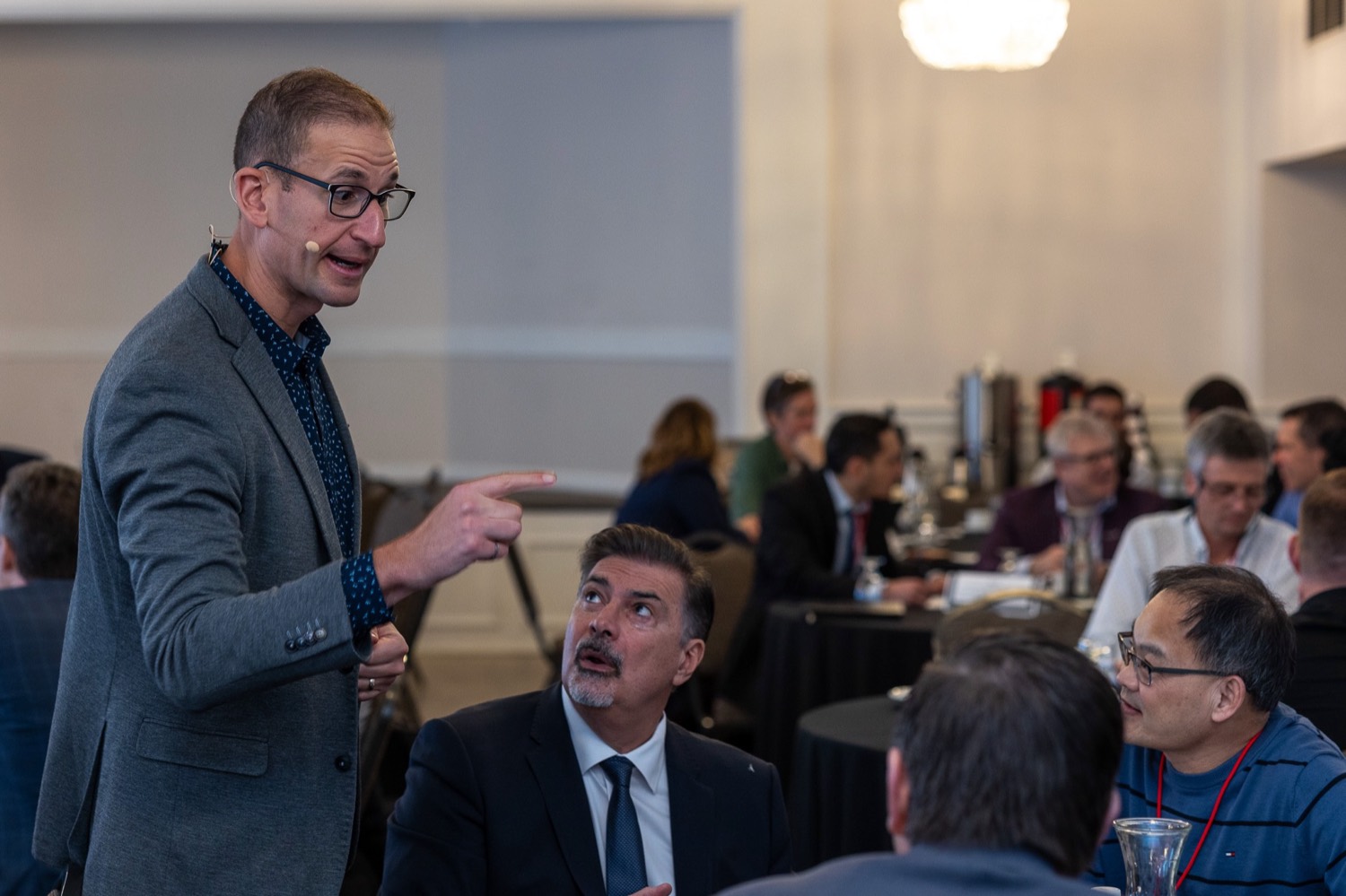 Ramy Nassar working a room of executives